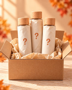 Pack Surprise : un carton contenant trois bouteilles sensorielles enveloppées de papier