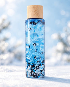Bouteille sensorielle Funny pingouins : des pingouins et des flocons dans un liquide bleu